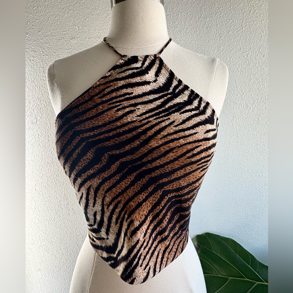 Tiger print halter top, featuring a self tie neck and back.